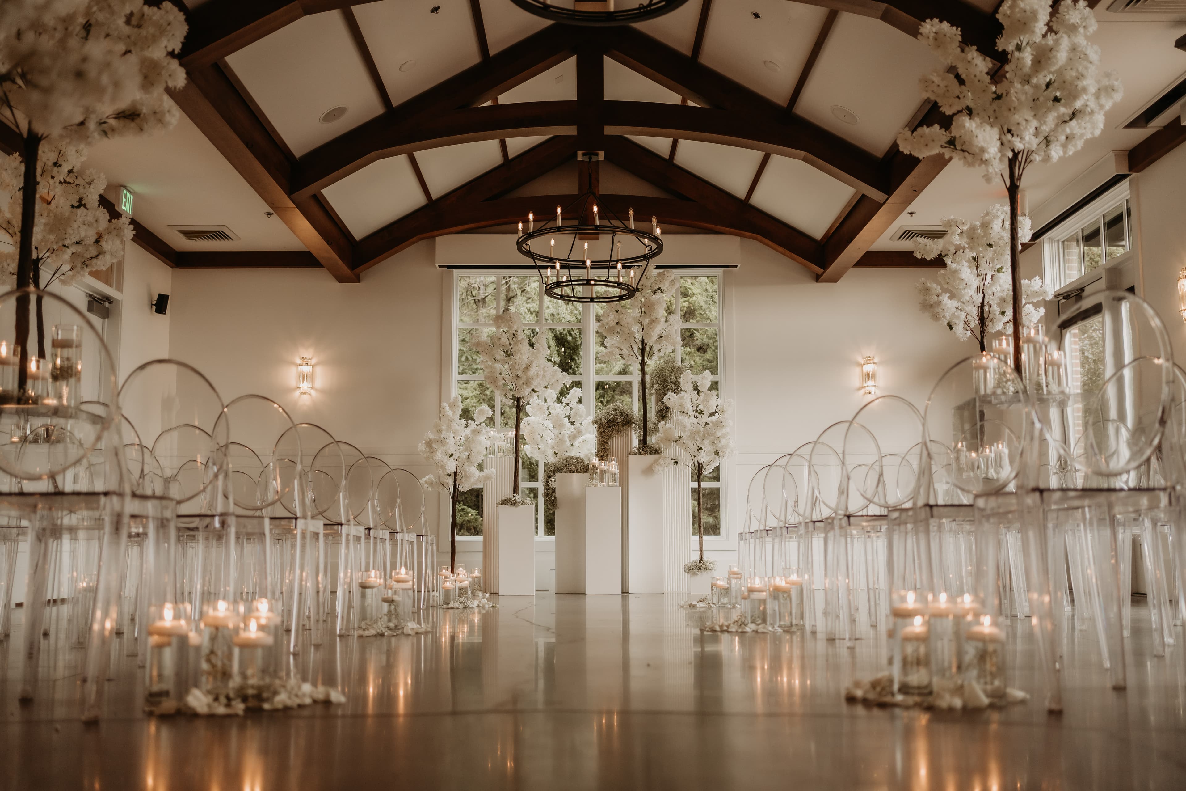 Elegant indoor wedding reception with candlelight and floral styling